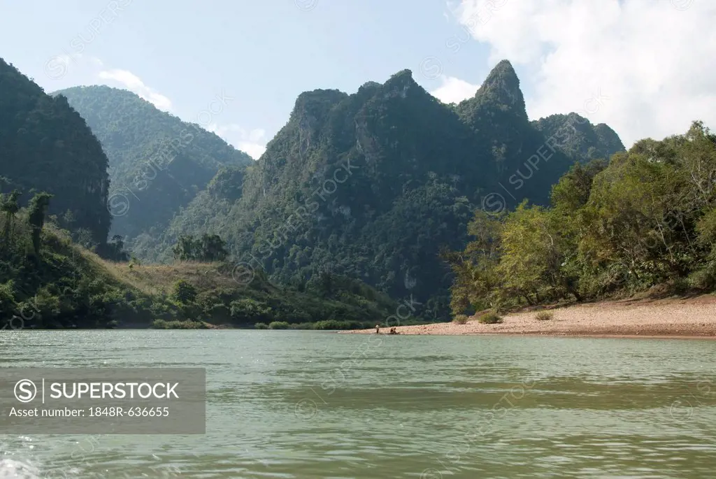 Karst landscape, forested mountains on the Nam Ou River in Muang Ngoi Kao, Luang Prabang province, Laos, Southeast Asia, Asia