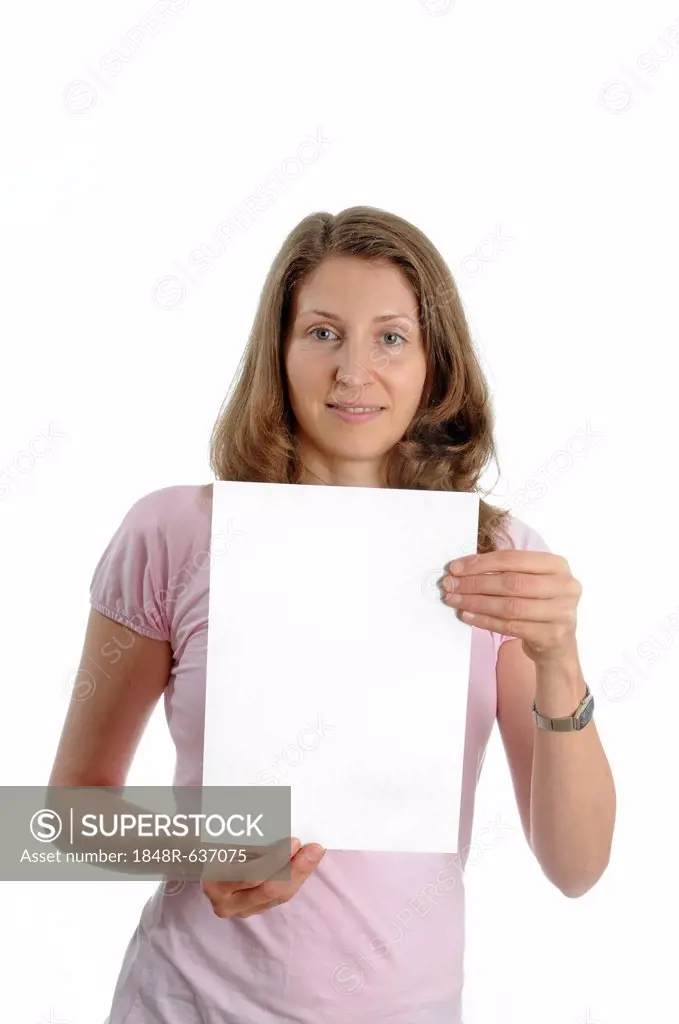 Young woman holding up a blank poster