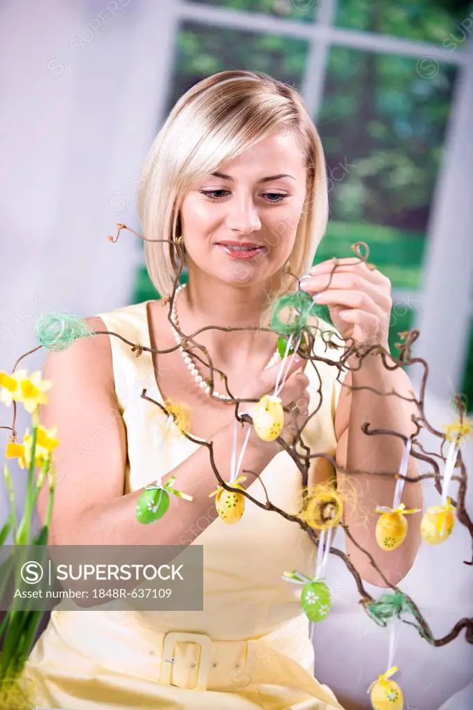 Young woman decorating for Easter