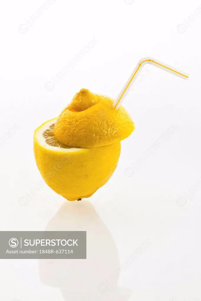 Lemon with a drinking straw as a soft drink