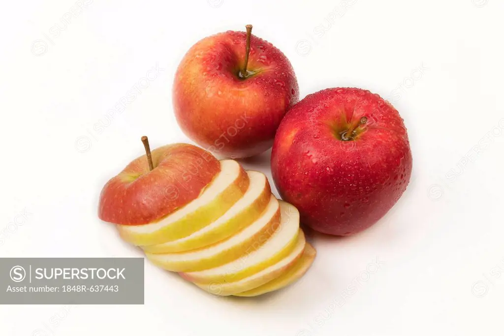 Two whole apples and apple slices