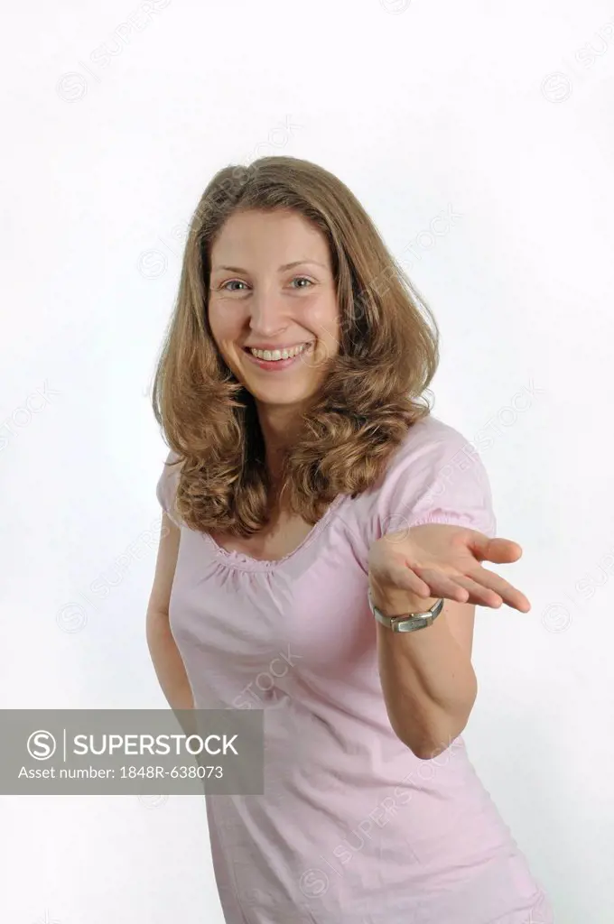 Young woman gesticulating with one hand, smiling