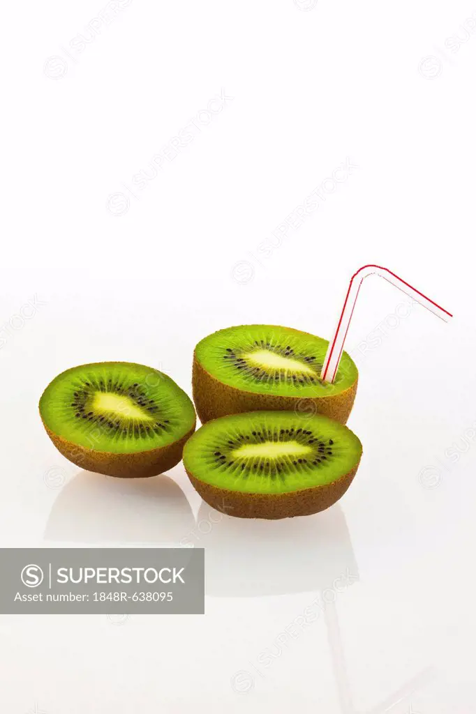 Kiwi fruit with a drinking straw as a soft drink