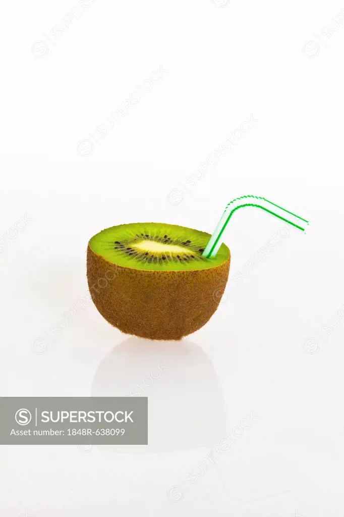 Kiwi fruit with a drinking straw as a soft drink
