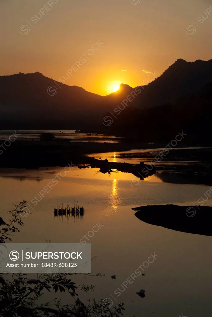 Sunset over the Mekong River, view from the temple of Wat Pha Bhat Tai, Luang Prabang province, Laos, Southeast Asia, Asia