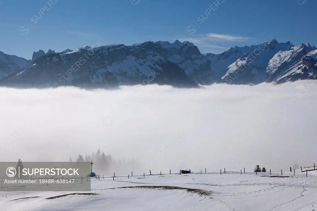 View of the Alpstein massif with Mt. Saentis and mountain pasture in the snow, Alpstein range, Swiss Alps, Switzerland, Europe