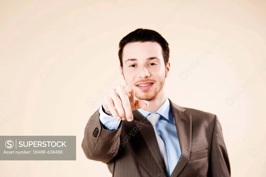 Businessman typing on an imaginary touchscreen