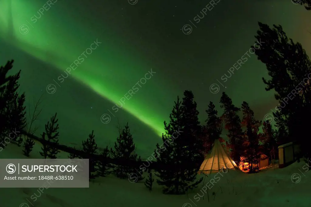 Illuminated, lit Tipi, Northern polar lights, Aurora Borealis, green, near Whitehorse, Yukon Territory, Canada