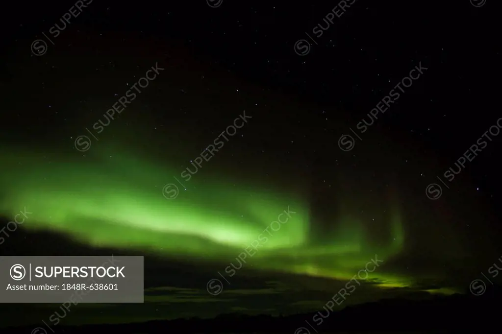 Swirling green northern polar lights (Aurora borealis), near Whitehorse, Yukon Territory, Canada
