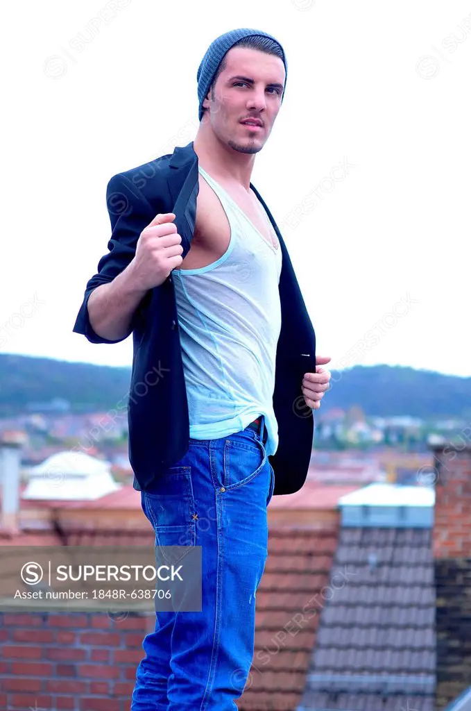 Young Italian man above the rooftops of Stuttgart, Baden-Wuerttemberg, Germany, Europe