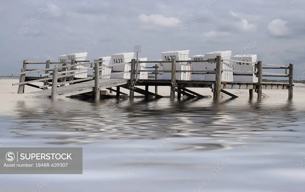 White roofed wicker beach chairs on a platform on stilts, beach on the North Sea, St. Peter-Ording, Schleswig-Holstein, Germany, Europe