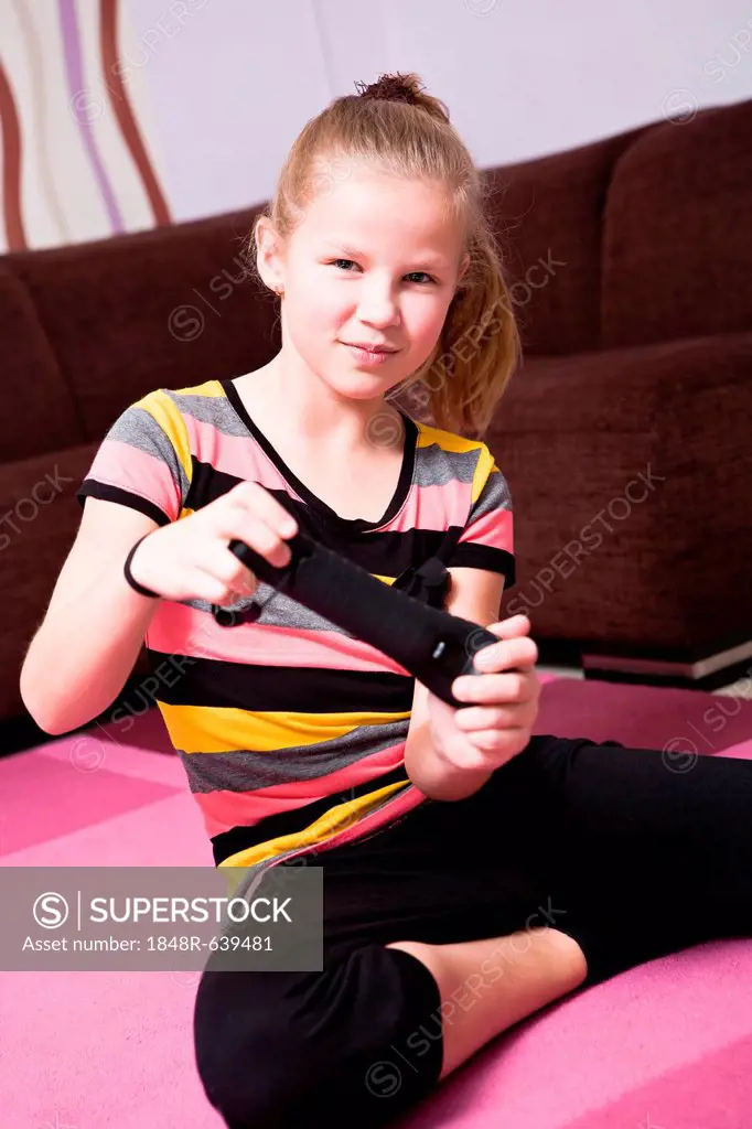Girl playing with game console