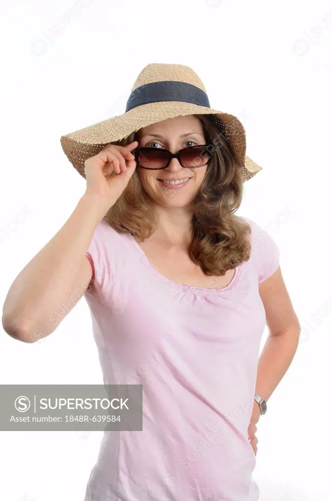 Young woman with sunglasses and a straw hat