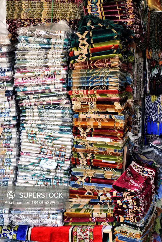 Textile trader in Souq al Waqif, the oldest souq or bazaar in the country, Doha, Qatar, Arabian Peninsula, Persian Gulf, Middle East, Asia