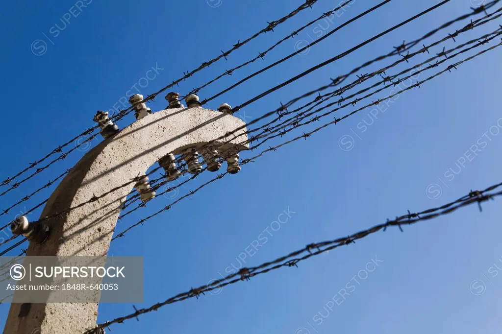Barb wire electric fence inside the Auschwitz I former Nazi Concentration Camp, Auschwitz, Poland, Europe