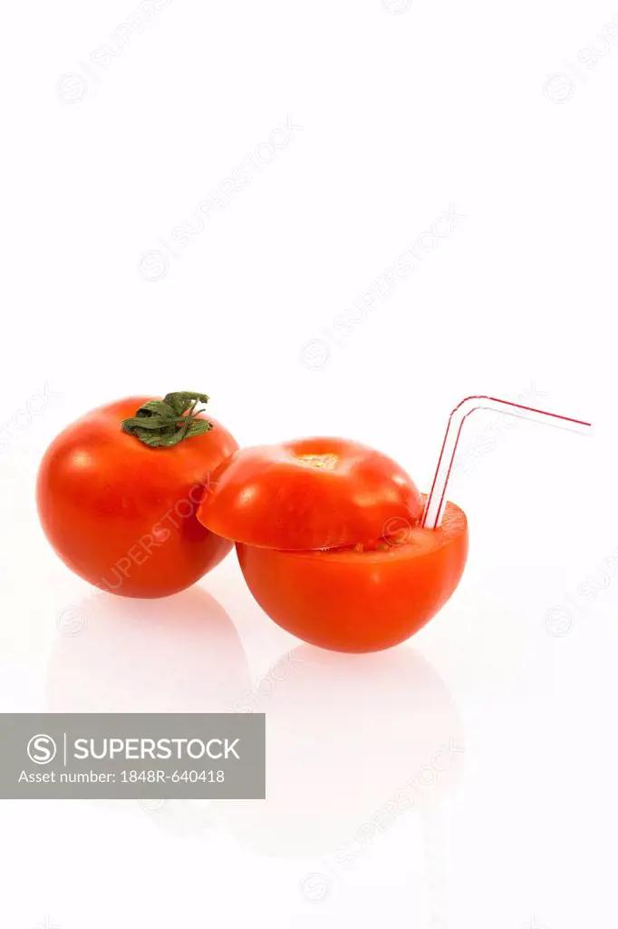 Tomatoes, tomato with a drinking straw as a soft drink