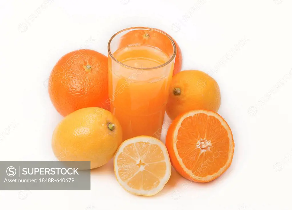 Oranges and lemons with a glass of orange juice