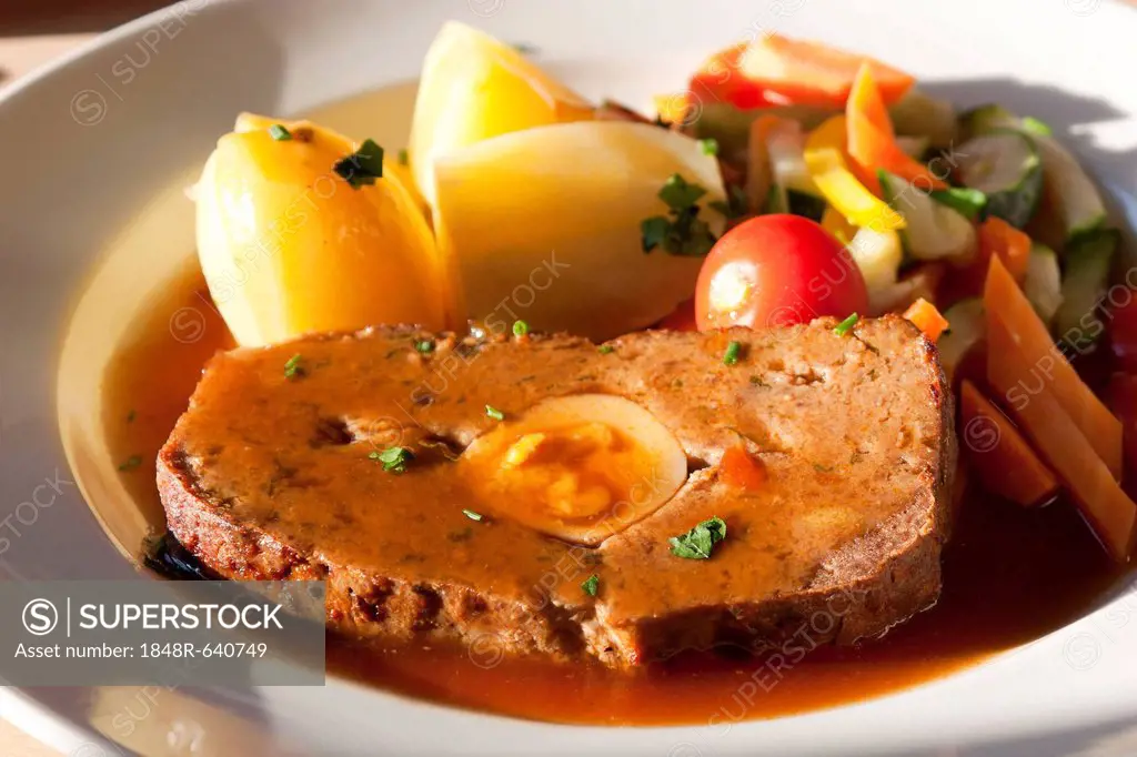 Meatloaf with vegetables, boiled potatoes and gravy