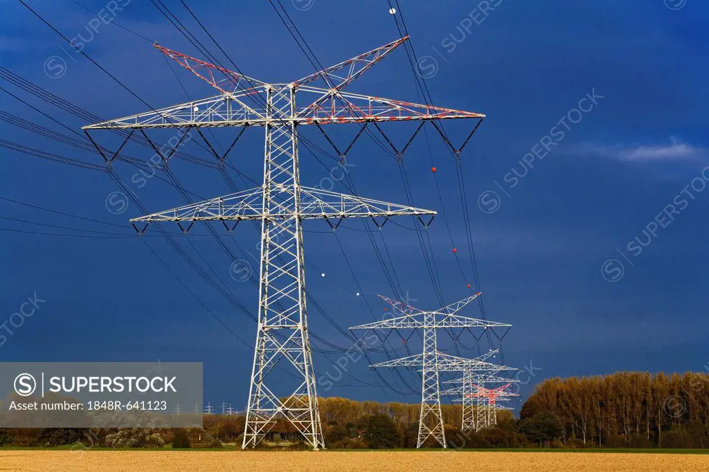 Power poles with power lines, near Dortmund, North Rhine-Westphalia, Germany, Europe