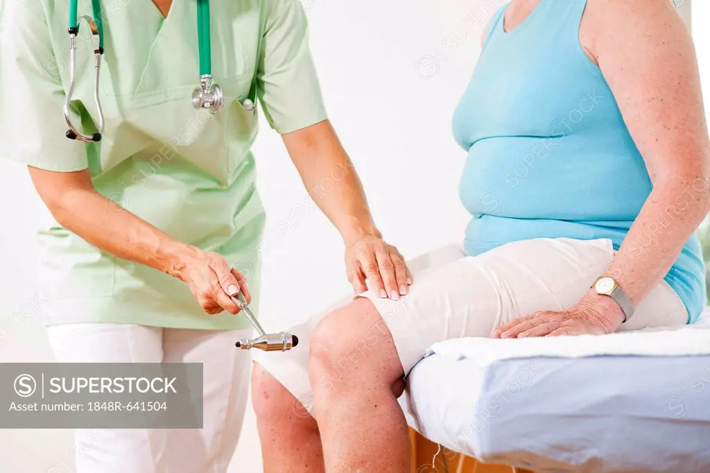 Orthopedic surgeon examining the knee of a patient