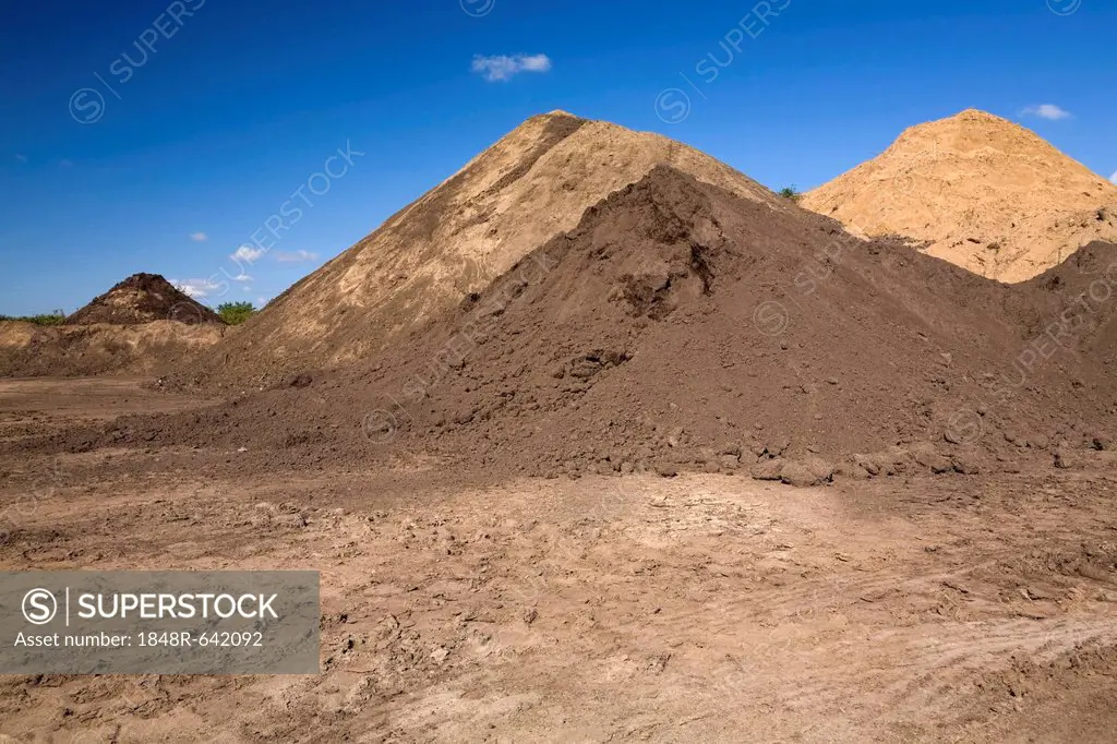 Mounds of sand in a commercial sandpit, Quebec, Canada