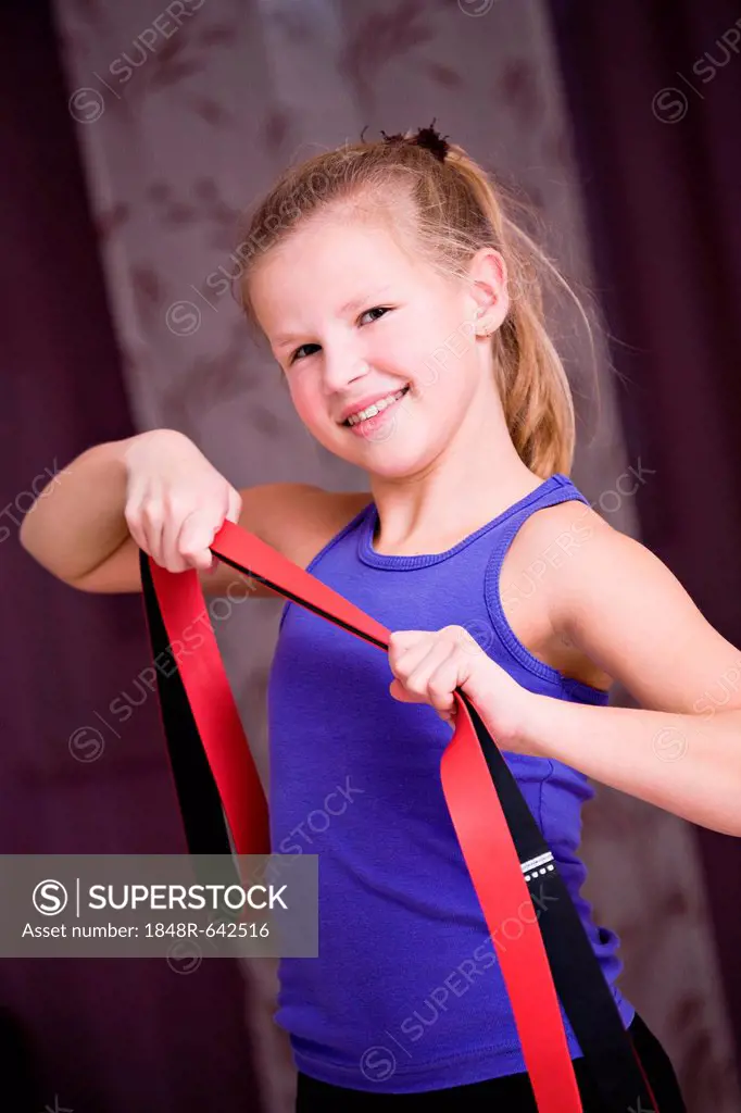 Girl, 8, using an exercise band