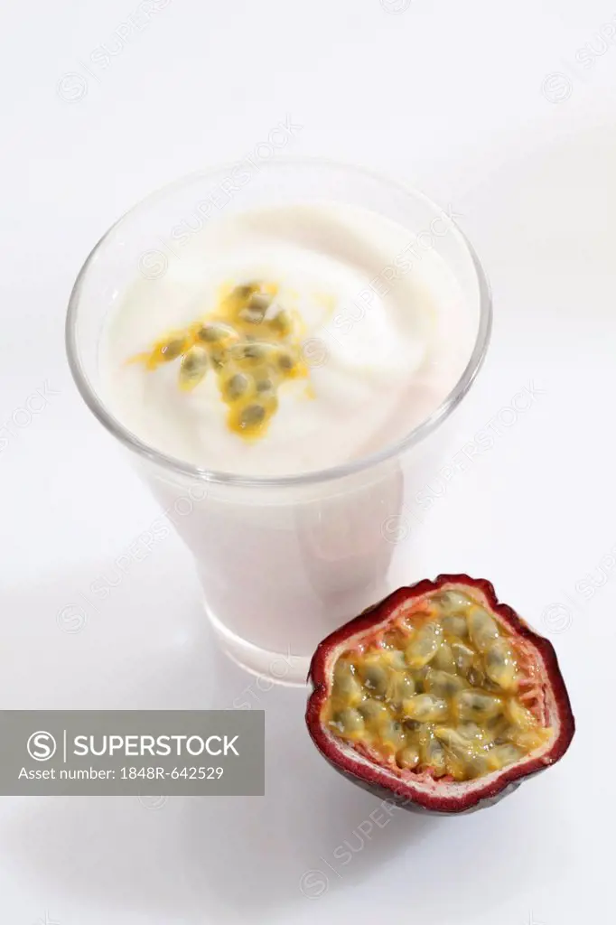 A glass of yogurt with a passionfruit