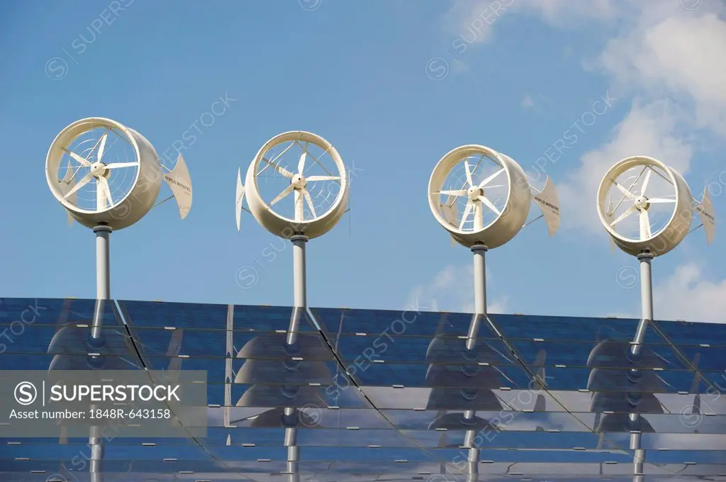 Small wind turbines and solar panels on the roof of a hotel, Freiburg im Breisgau, Baden-Wuerttemberg, Germany, Europe