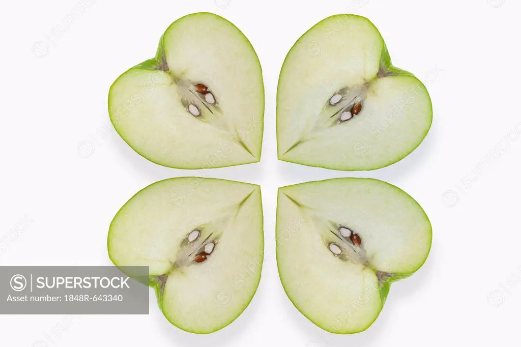 Heart-shaped apples placed like a clover leaf