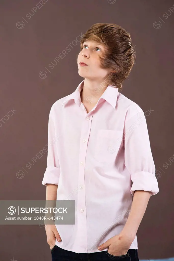 Boy looking up with a contemplative expression