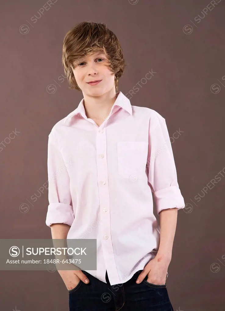Boy wearing a shirt with his hands in his pockets
