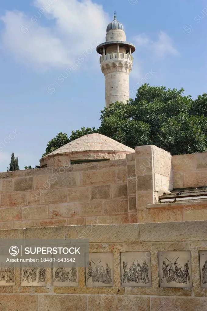 Christian monument on Via Dolorosa, reliefs of the Passion of Jesus, in the Arab quarter, in front of a minaret on Temple Mount, Jerusalem, Israel, Mi...