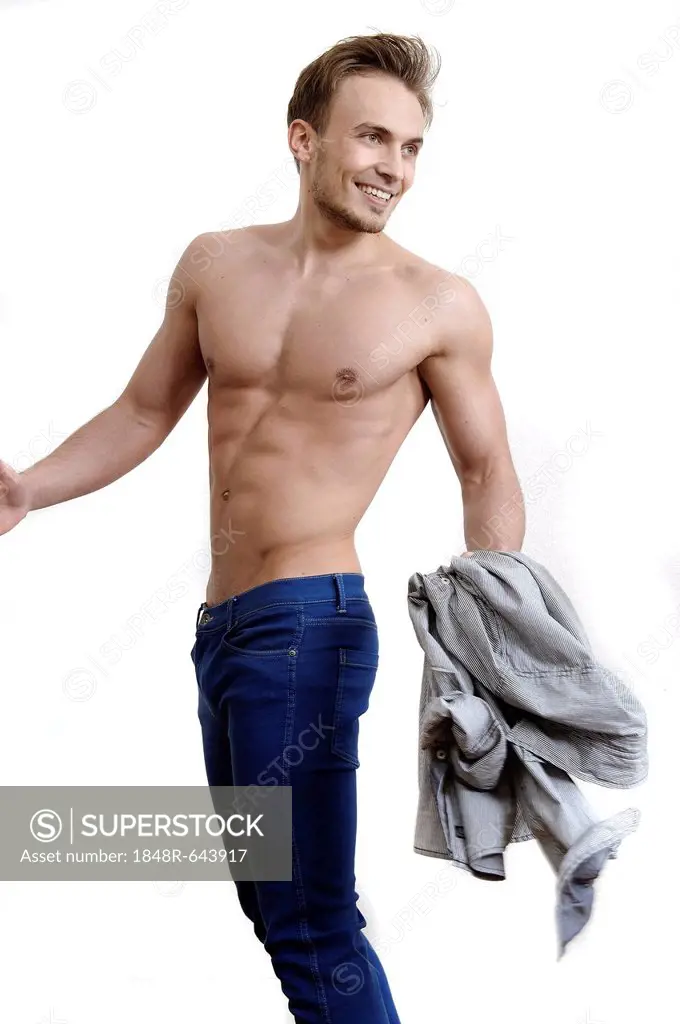 Bare-chested young man wearing jeans