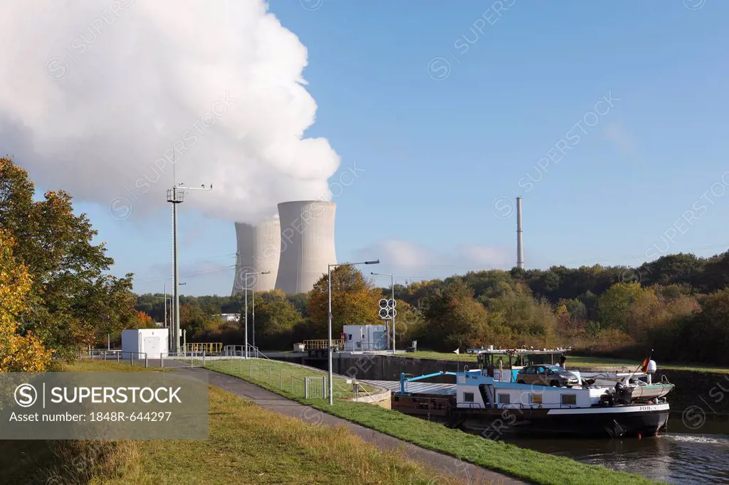Cargo ship on the Main River in the Garstadt Lock, in front of the cooling towers of Grafenrheinfeld Nuclear Power Plant near Schweinfurt, Lower Franc...