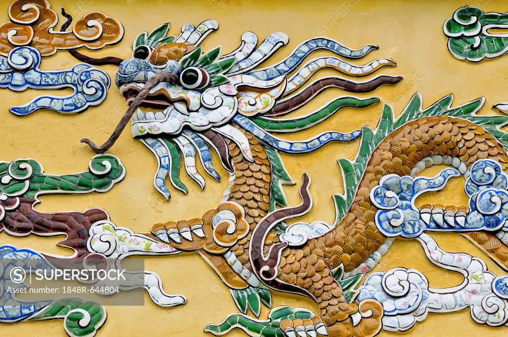 Dragon figure made of porcelain fragments on a yellow wall, Hoang Thanh Imperial Palace, Forbidden City, Hue, UNESCO World Heritage Site, Vietnam, Asi...