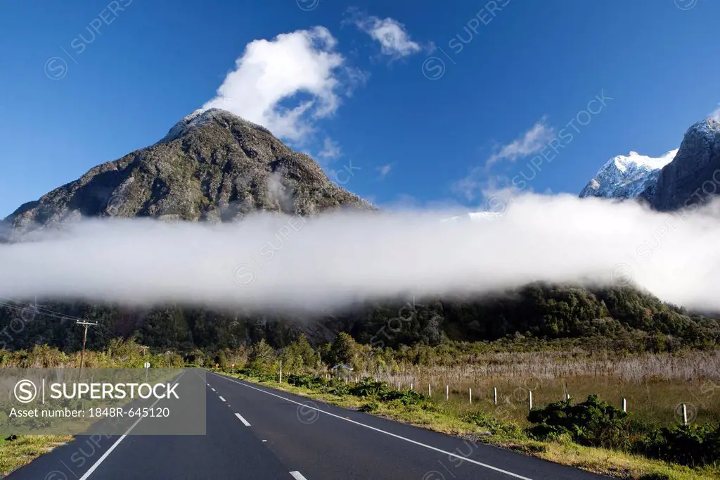 Low-hanging clouds moving through the Patagonian Andes over the Pan-American Highway, Carretera Austral, Ruta CH7, Region de los Lagos, Patagonia, Cha...