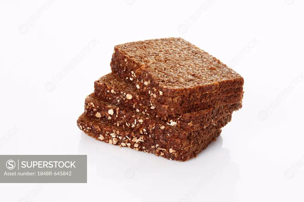 Slices of dark whole-grain bread with oatmeal, stacked