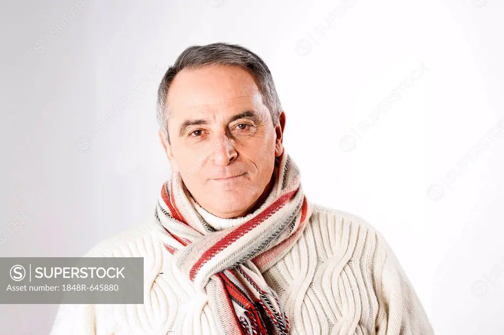 Elderly man wearing a scarf