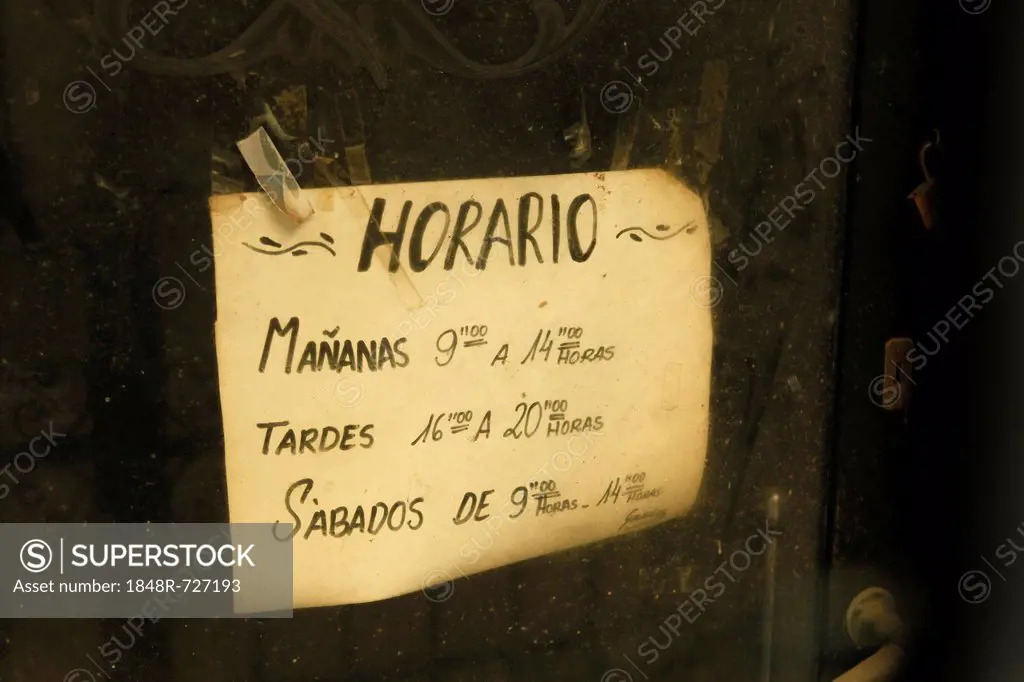 Old handwritten opening times sign on the door of a shop, Palma, Majorca, Mallorca, Balearic Islands, Spain, Europe