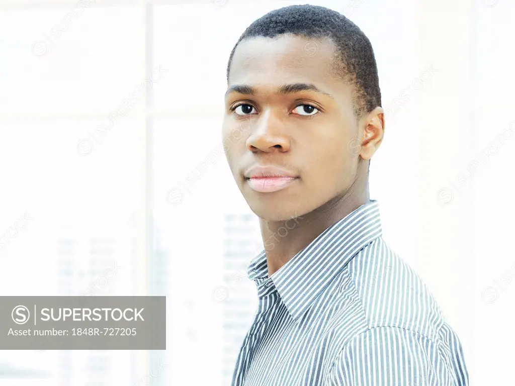 Young man, African-American businessman, American, serious face, respectable