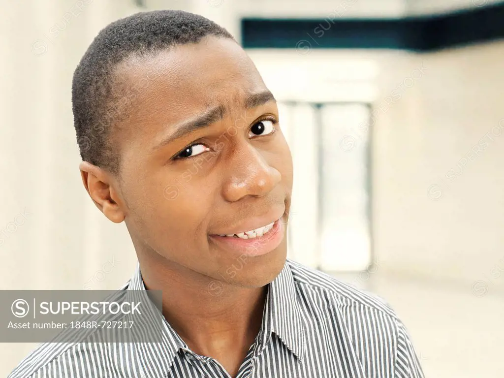 Man, young, African-American, American, friendly, looking skeptical, questioning, smiling