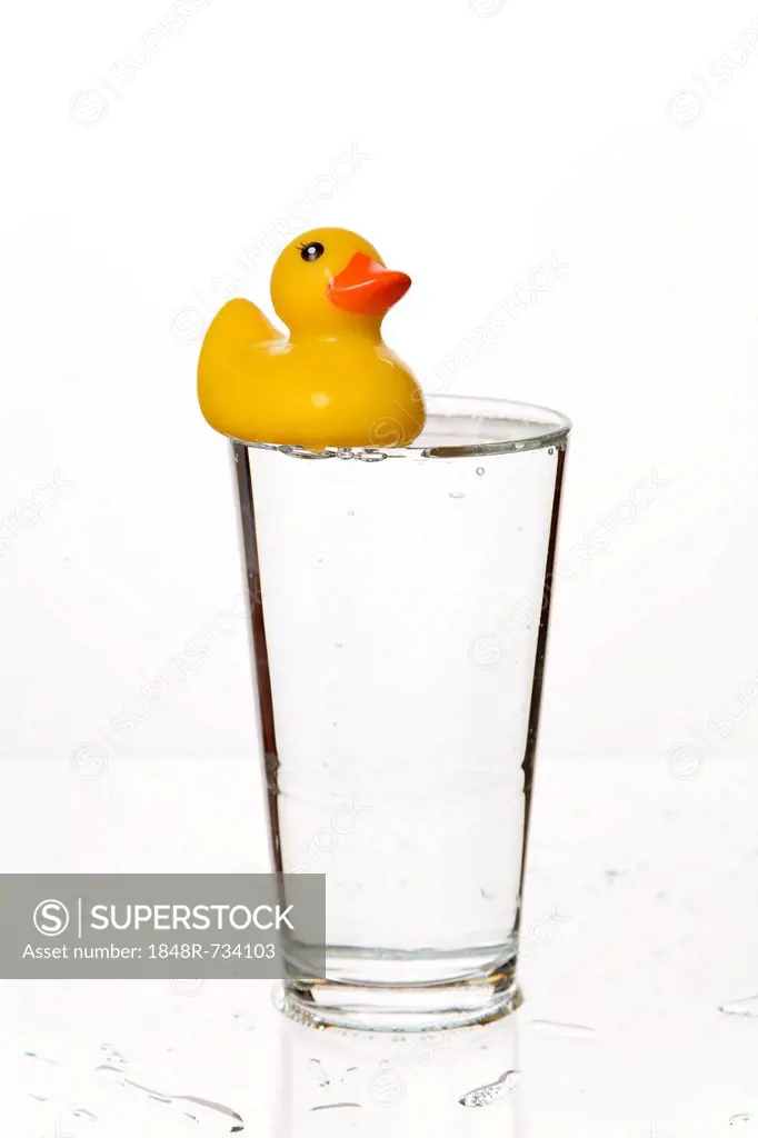 Glass with a yellow rubber duck
