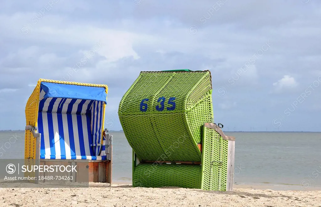 Canopied beach chairs on the North Sea coast, Wyk auf Foehr, Schleswig-Holstein, Germany, Europe
