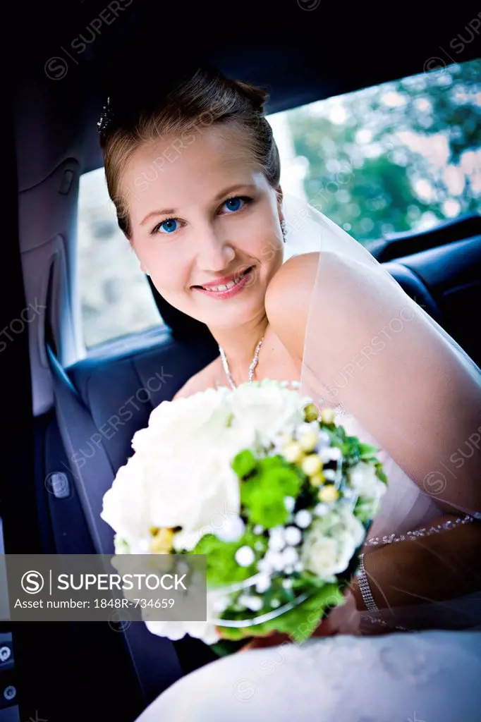 Young bride in the car