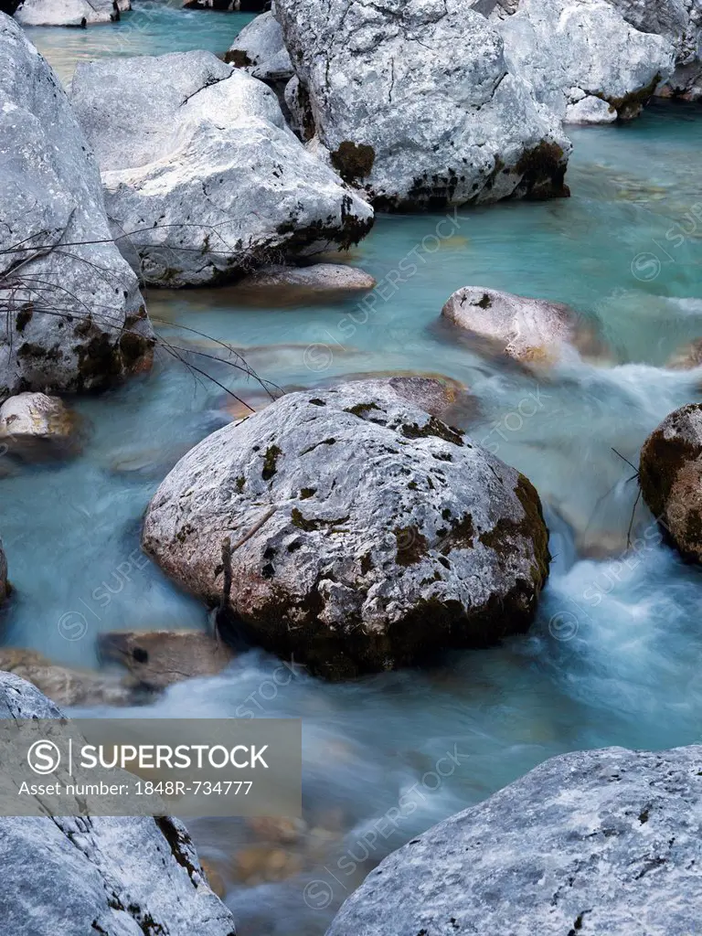Boulders and stones in the river bed of the Soca river, Soca Valley near Bovel, Triglav National Park, Slovenia, Europe