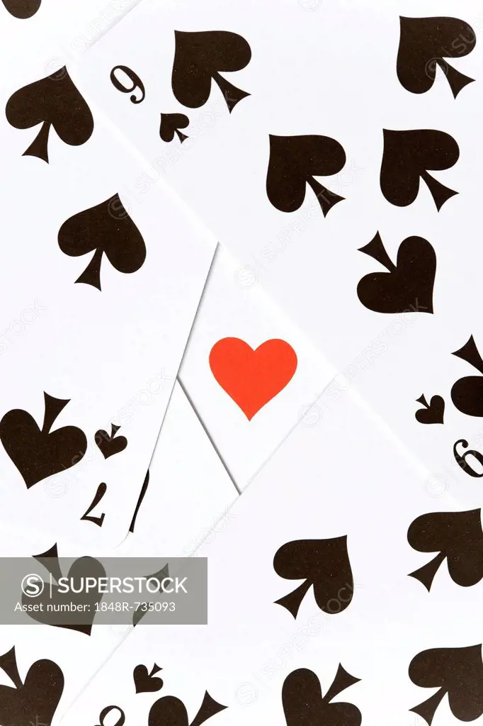 Playing cards, many spades around a single heart
