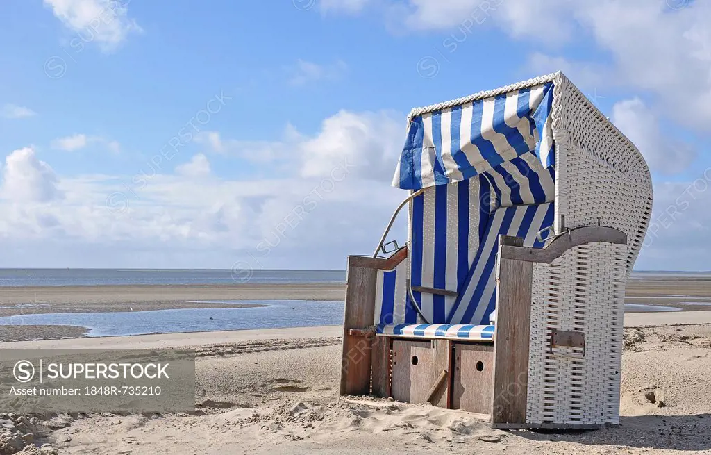Canopied beach chair on the North Sea coast, Wyk auf Foehr, Schleswig-Holstein, Germany, Europe