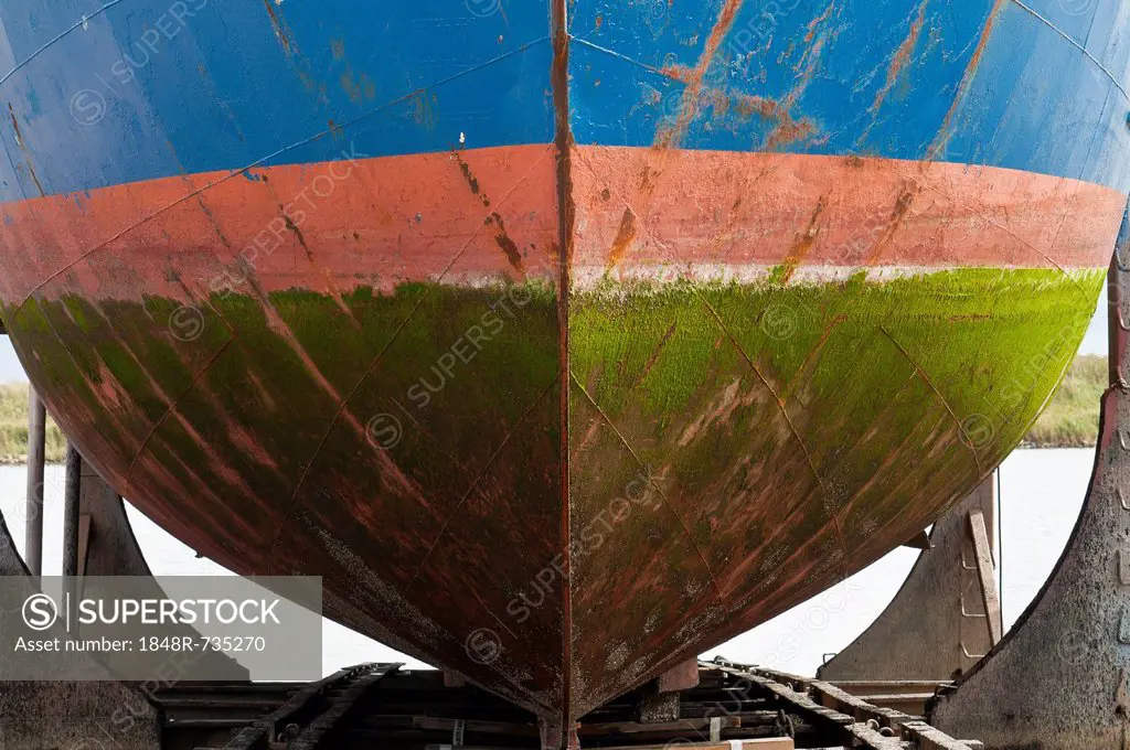 Coloured hull covered with algae in the dry dock, Hvide Sande, Jutland, Denmark, Europe