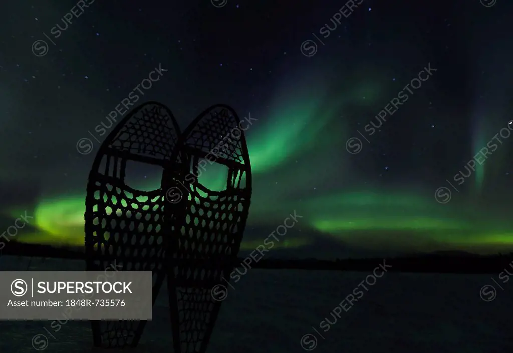 Silhouette of traditional wooden snow shoes, northern polar lights, Aurora borealis, green, near Whitehorse, Yukon Territory, Canada, America