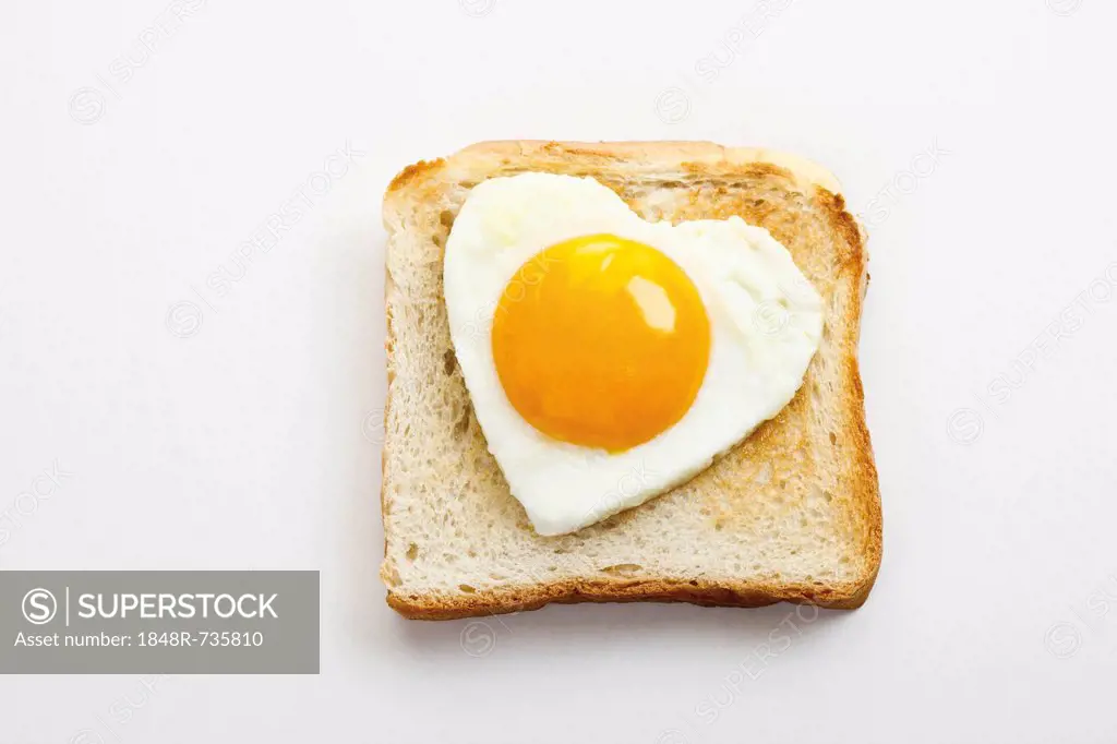 Toast with heart-shaped fried egg